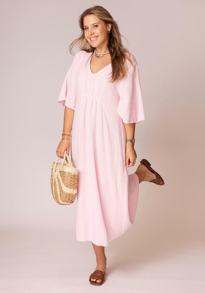 Wat draag je op een mouwloze jurk?